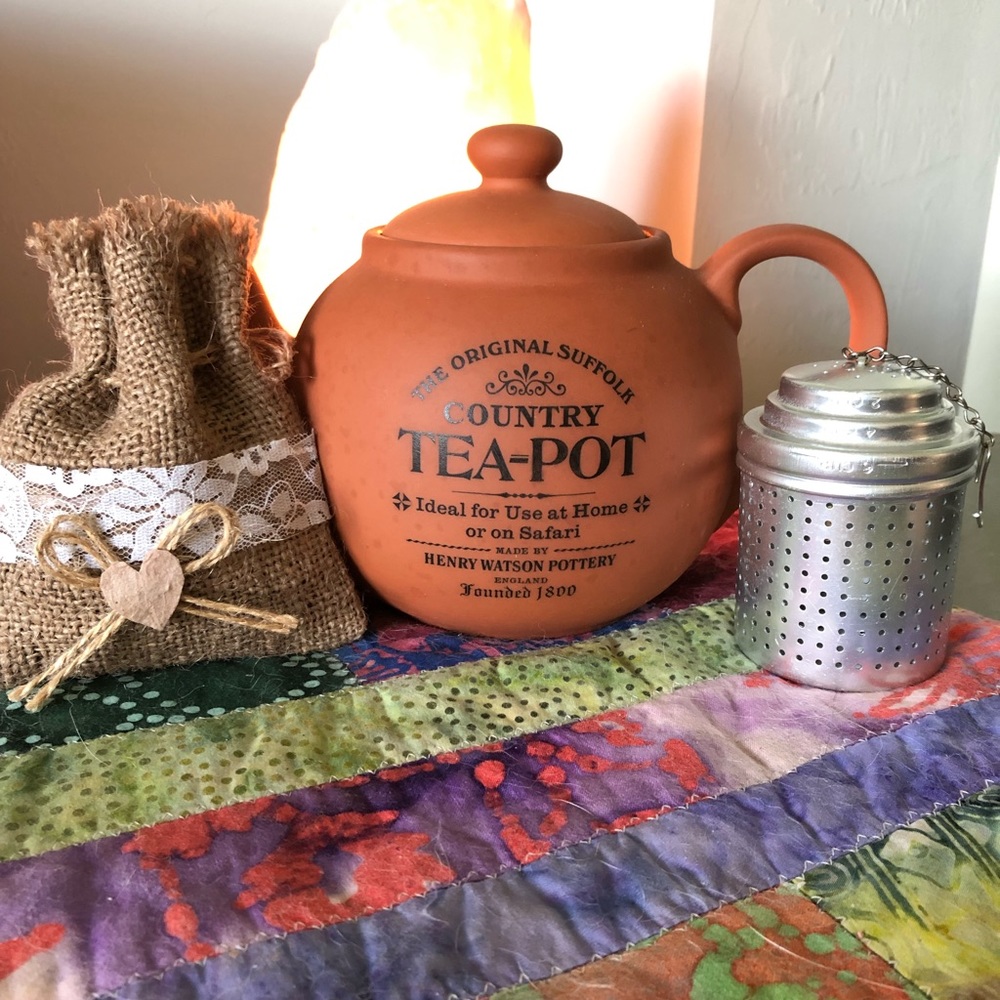 Vintage tea pot, tea infuser, and organic tea